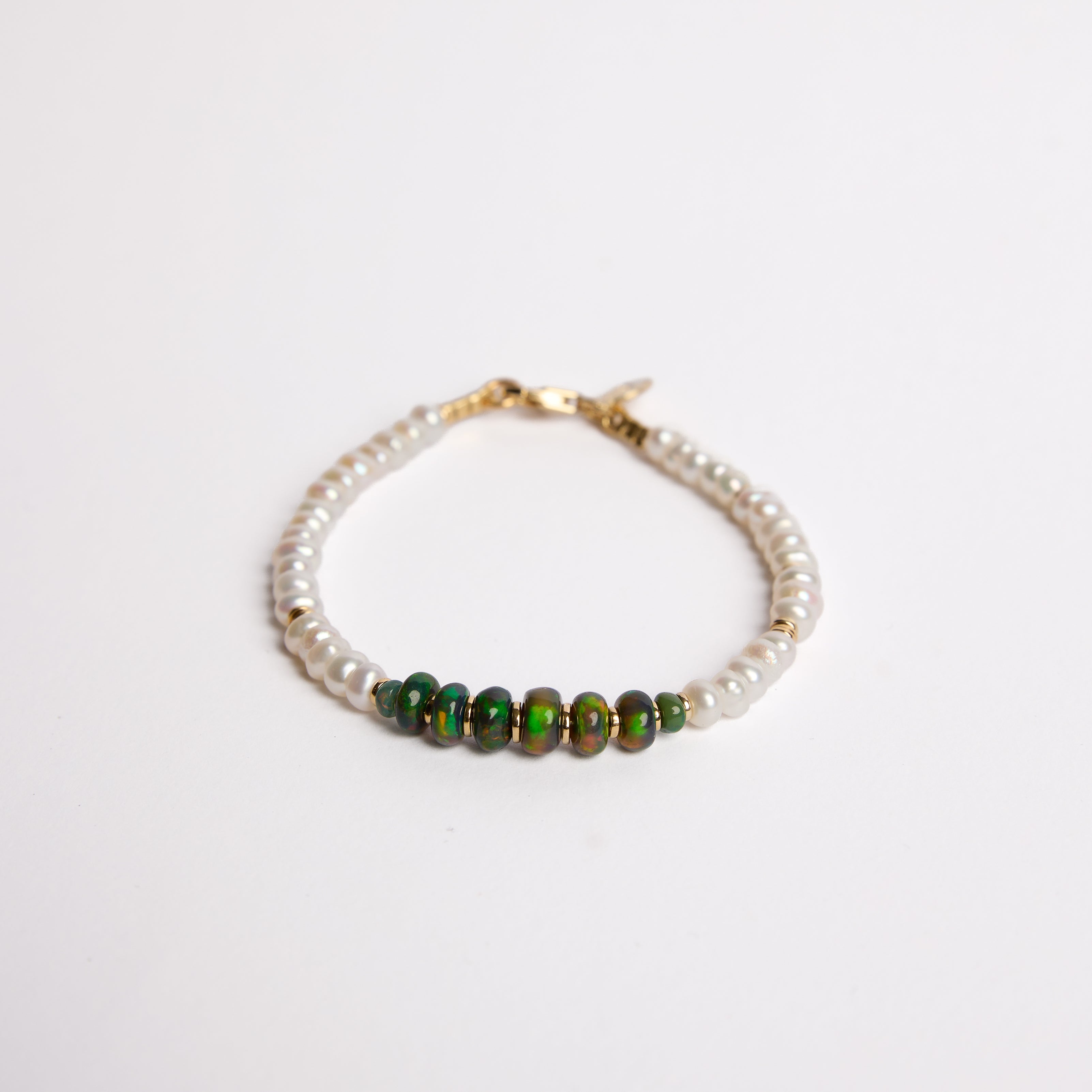 PULSERA DE HEMATITA - CON ESFERA RELLENA DE ORO